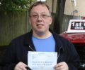 Brian with Driving test pass certificate